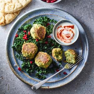 Cavolo Nero, Chickpea Falafels, Harissa on a plate with flatbread