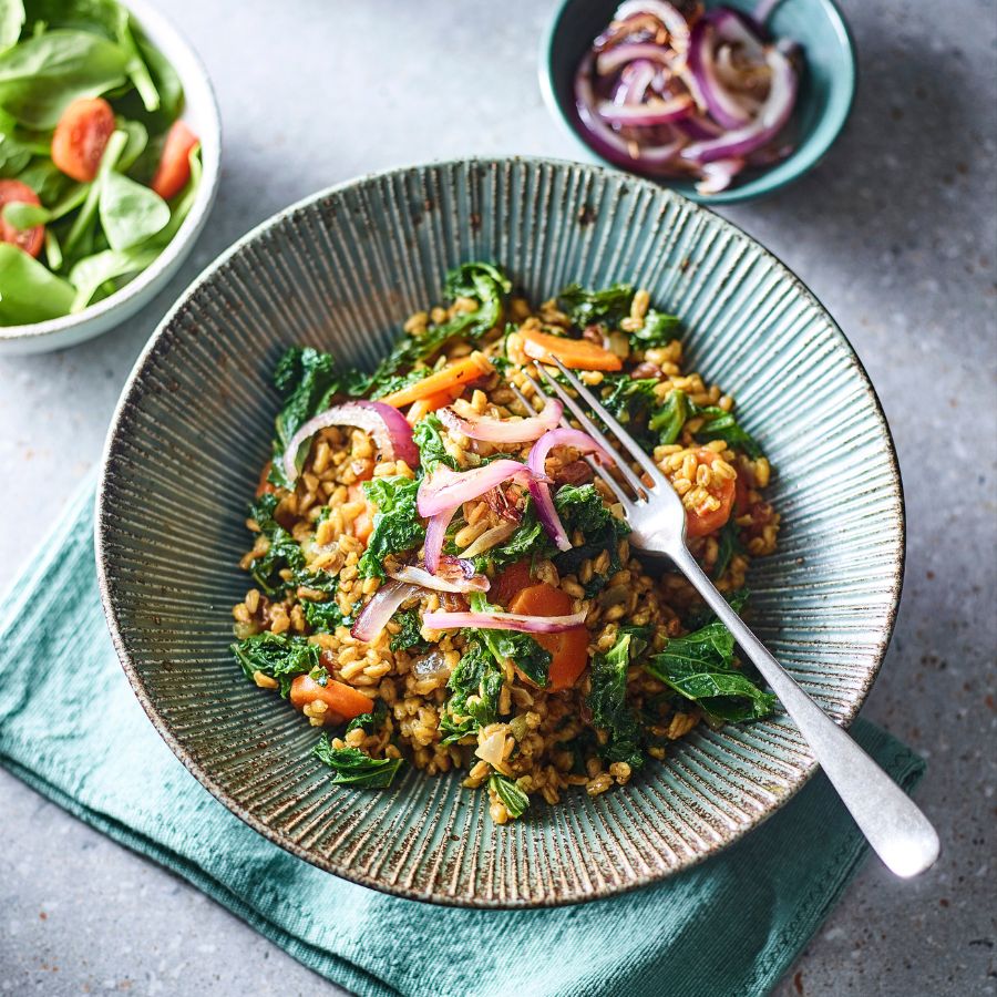 Kale and carrot pilaf in a bowl
