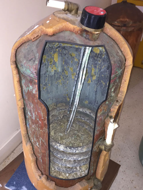 Hot water tank full of lime scale