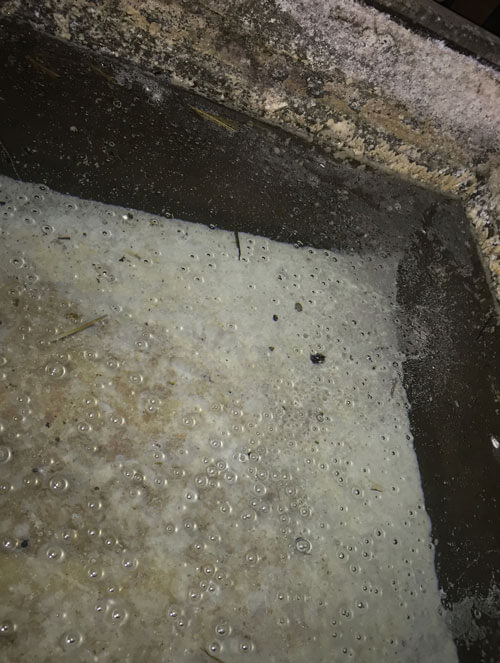 Water tank with over a foot of scale in