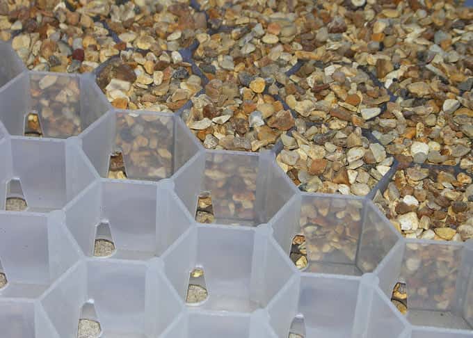 The gravel is contained within robust interlocking trays