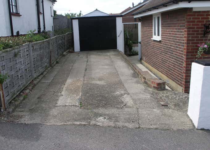A conventional driveway in need of replacement