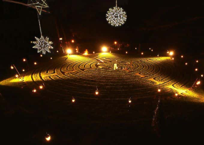 Permanent lighting is supplemented by tea lights at the labyrinth opening ceremony