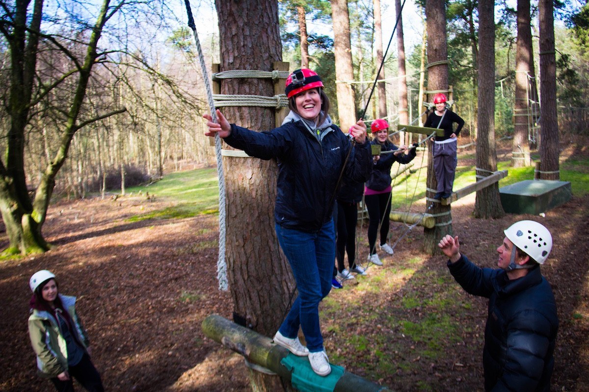 A group of friends playing Battlefield LIVE after looking for fun activities for adults in The New Forest.