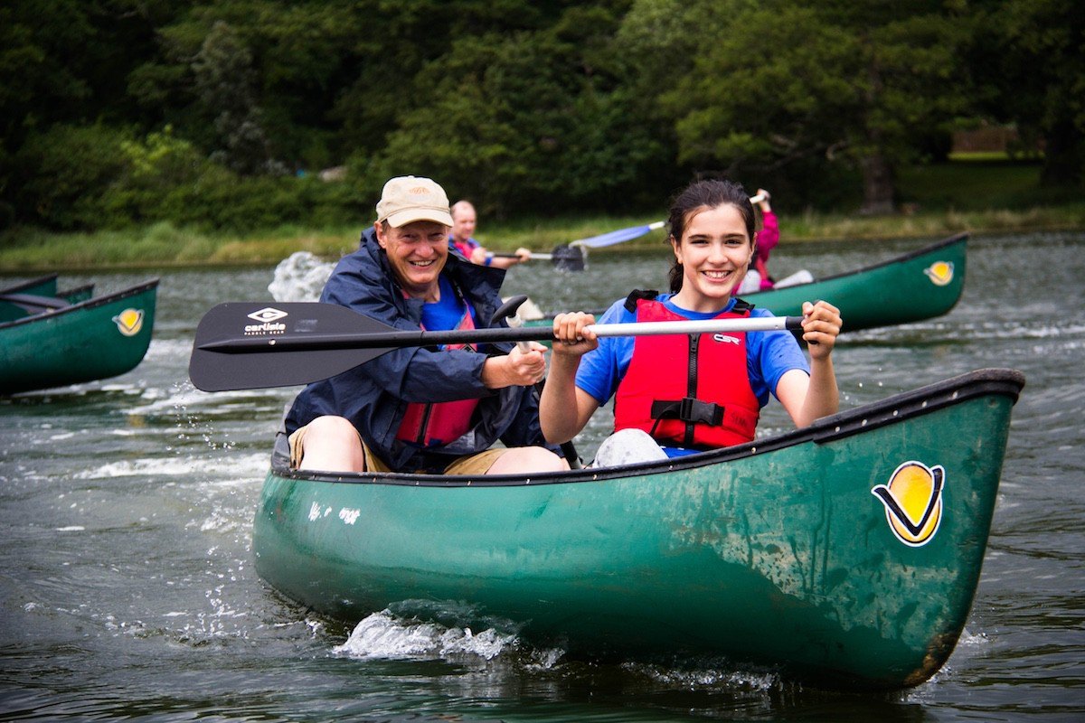 Youth activities include canoeing on the Beaulieu River.