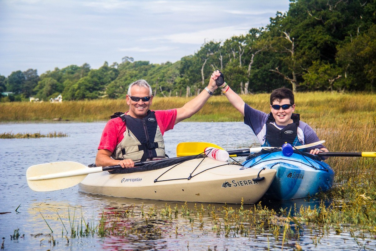 Father and son enjoying a kayaking taster on The Beaulieu River.