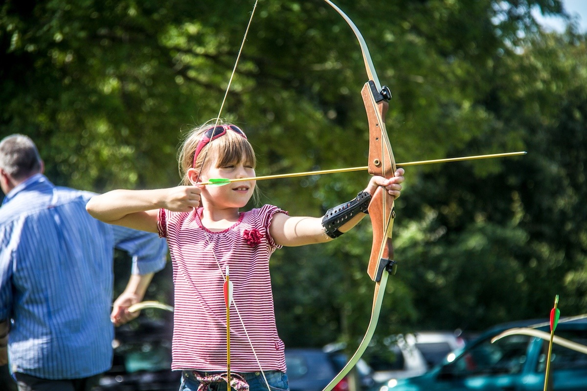 A group of kids enjoying school holiday activities with New Forest Activities.