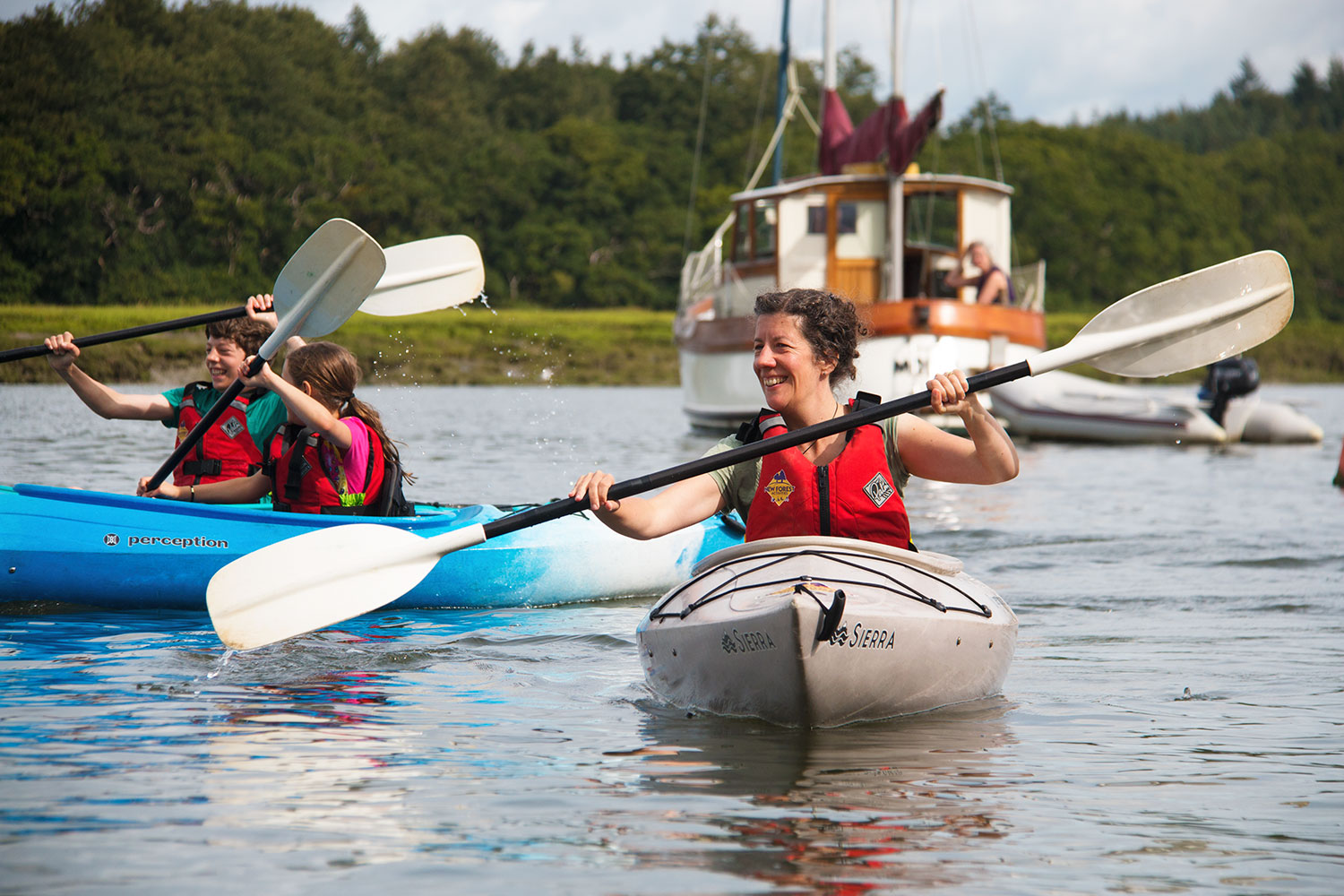 A family kayaking together on the Beaulieu River