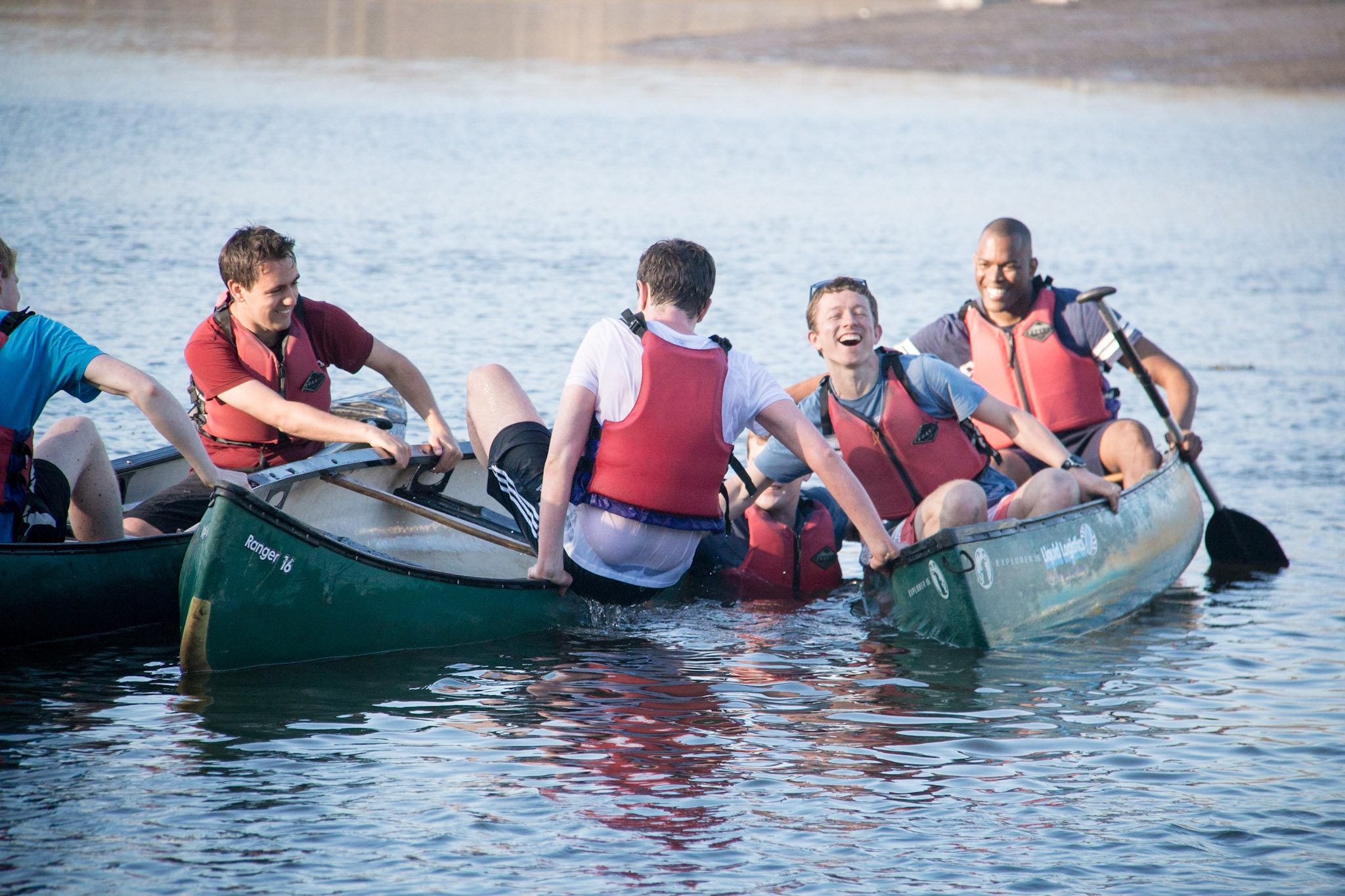 Man falling from a canoe.
