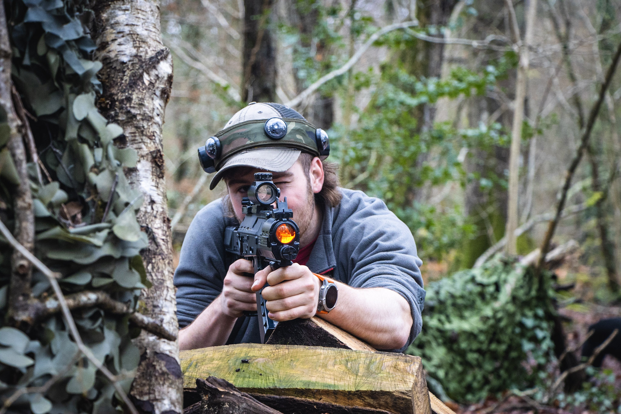 A man enjoying BattleZone at New Forest Activities as part of a Woodland Warmer team building day
