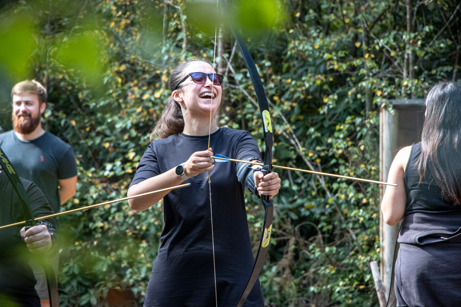 A lady trying her hand at archery in The New Forest