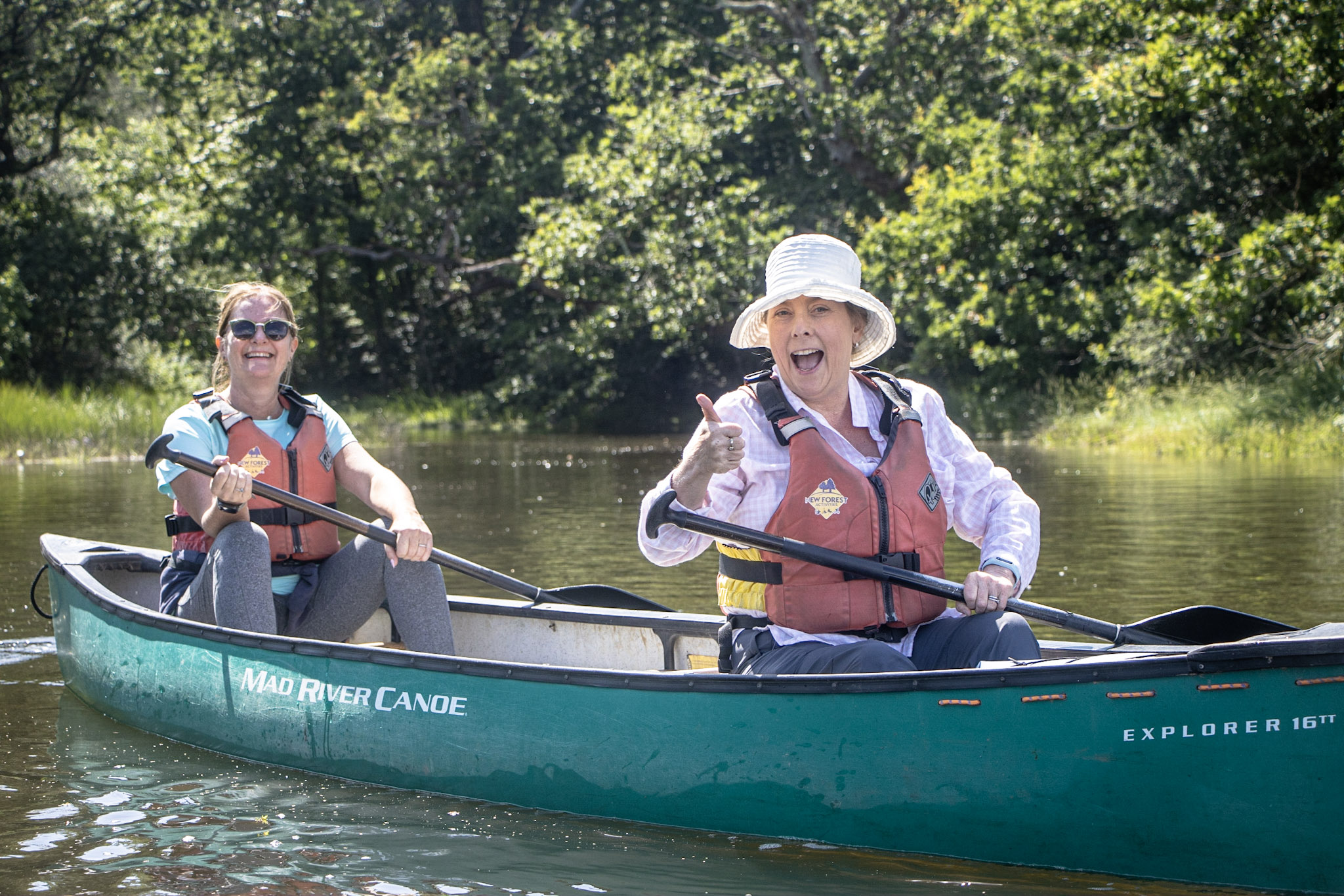 A group enjoying private activities, canoeing on the Beaulieu River A group enjoying private activities, canoeing on the Beaulieu River