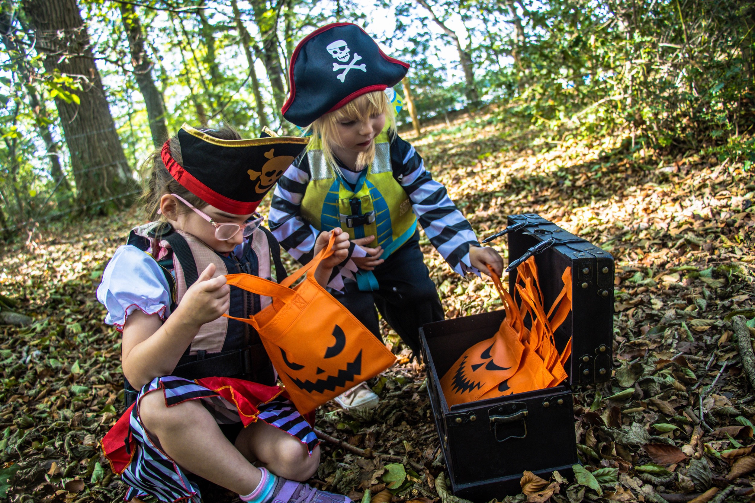 A family enjoying a Canoe Halloween Candy Hunt