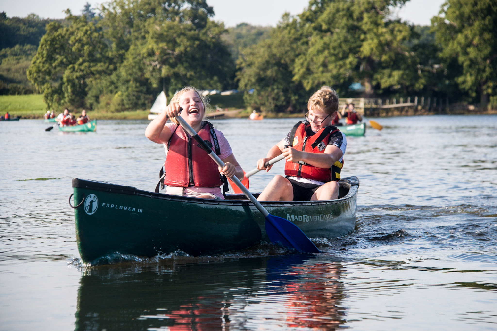 Two students canoeing on the Beaulieu River suring their residential trip in The New Forest