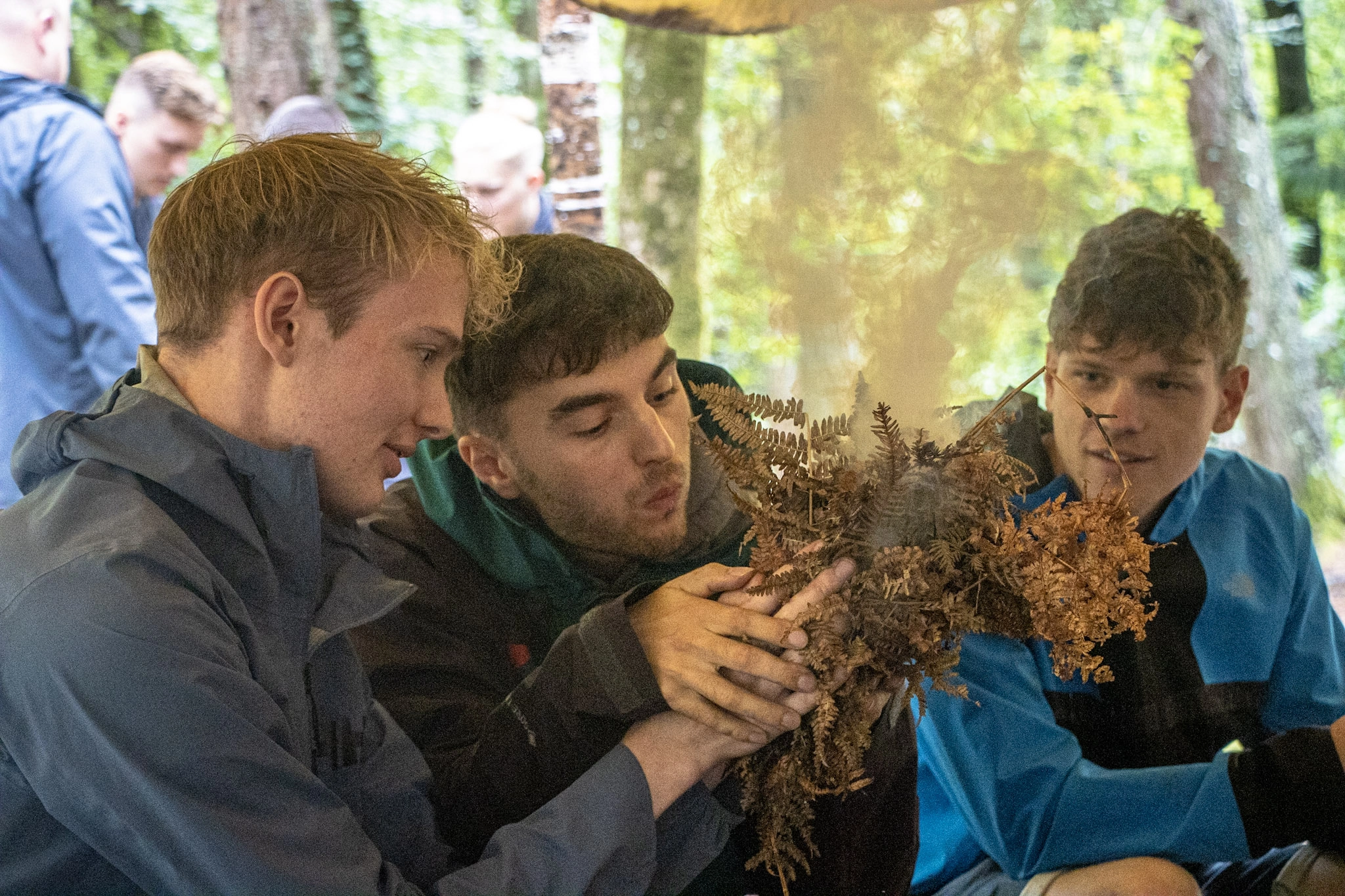 Learning fire lighting during a bushcraft session