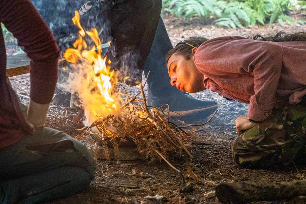 Fire lighting during a family bushcraft session