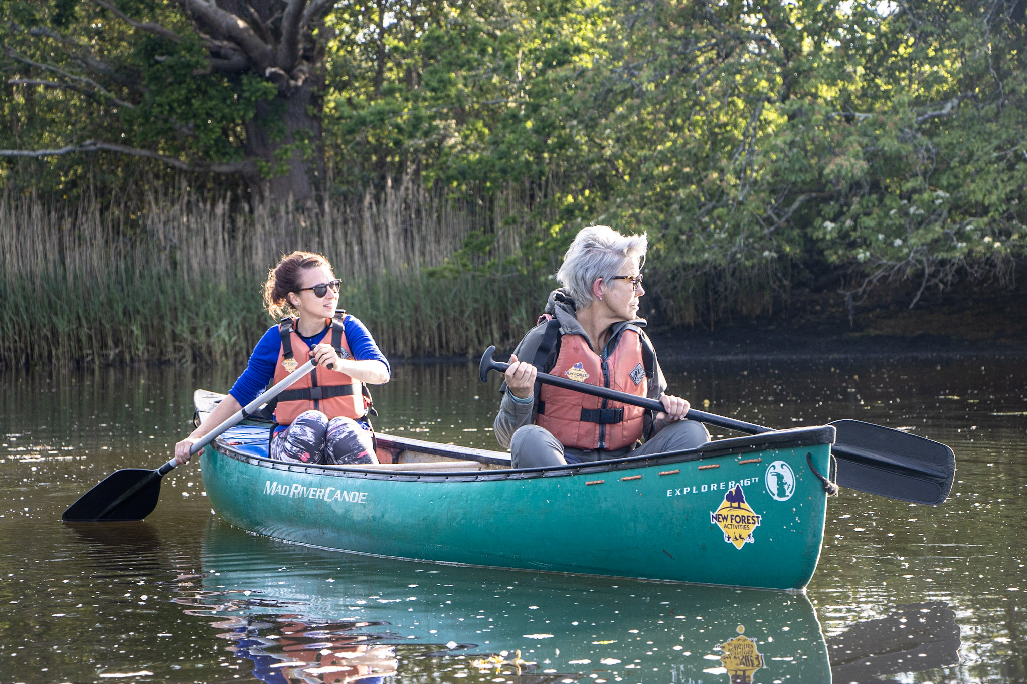 A mother and daughter enjoying a canoeing tour on the Beaulieu River
