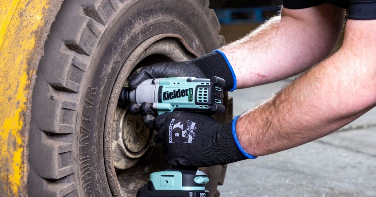 Work gloves holding drill for construction and industrial use