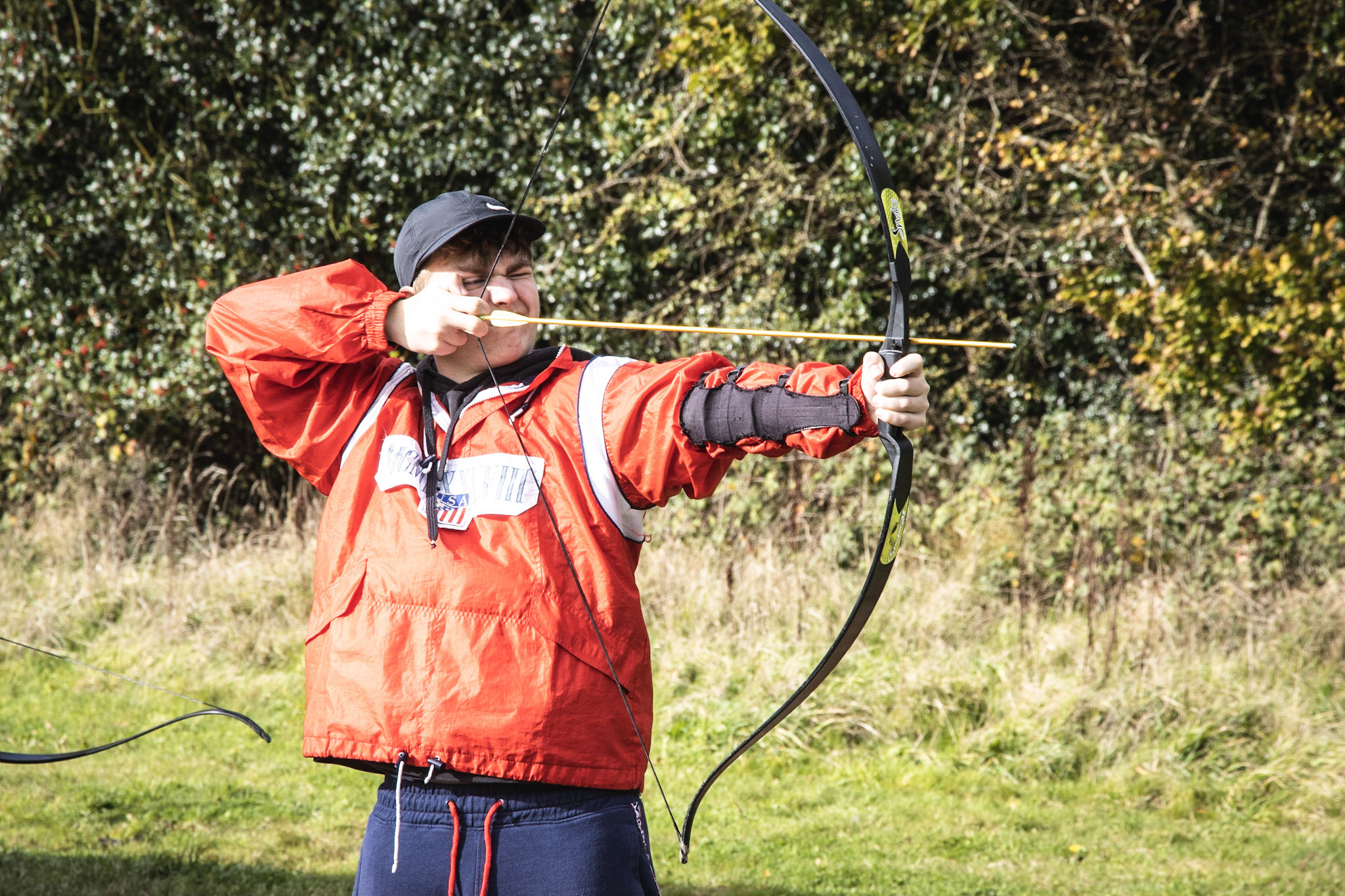 A man taking part in a guided archery session
