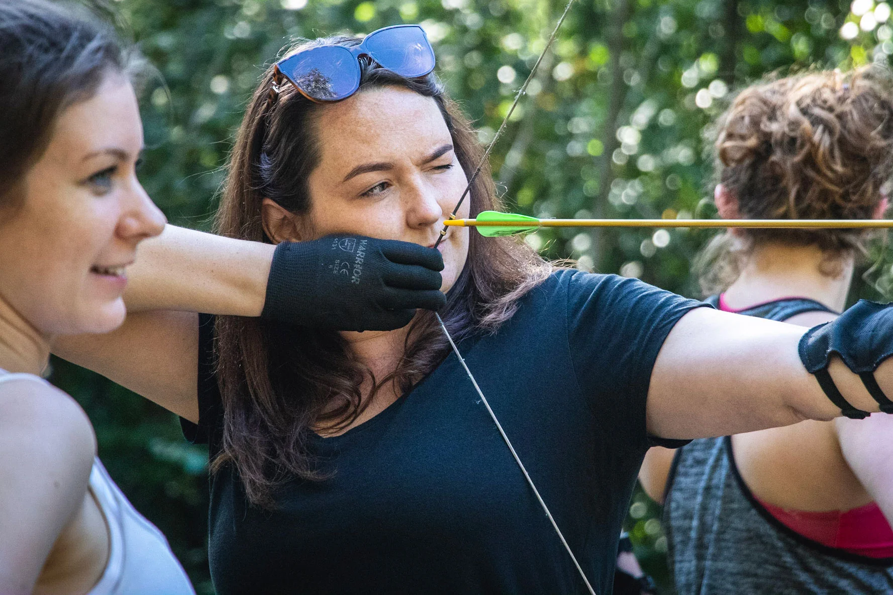 A group of women enjoying an archery Hen Party at Cairngorms Activities