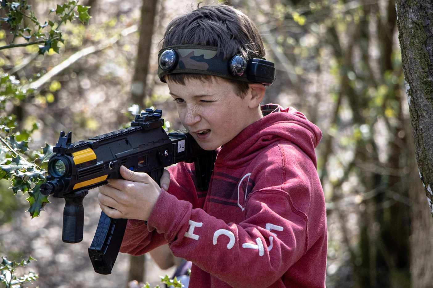 A boy playing the laser tag game, BattleZone