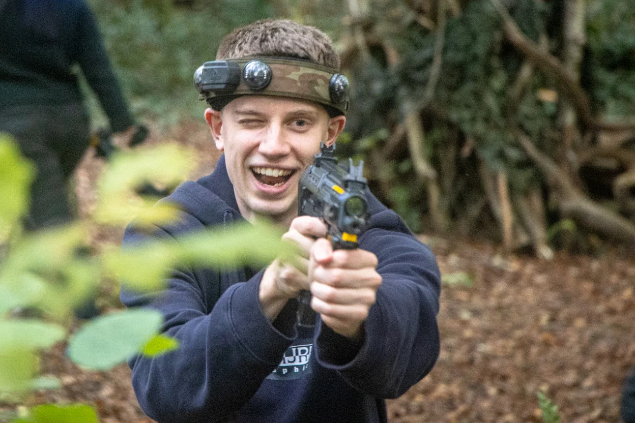 A man taking part in a BattleZone session with his friends