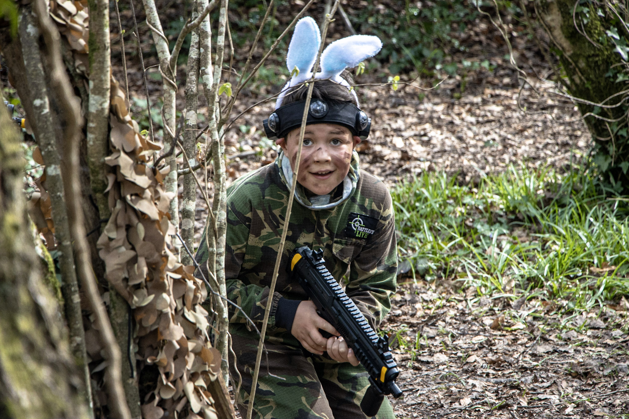 A boy playing the laser tag game, BattleZone during an Easter Adventure Trail