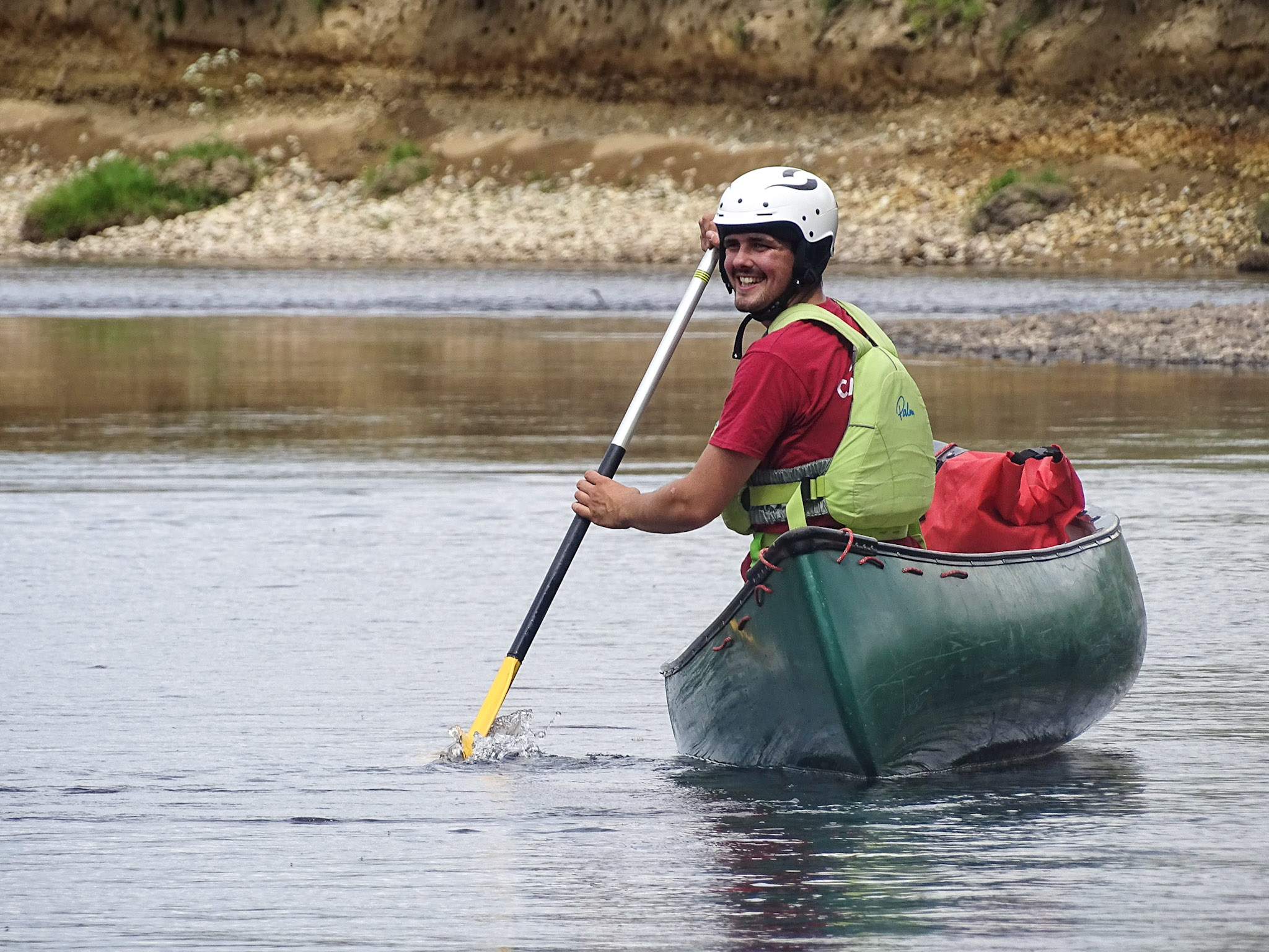 An Outdoor Instructor Canoeing along the River Spey