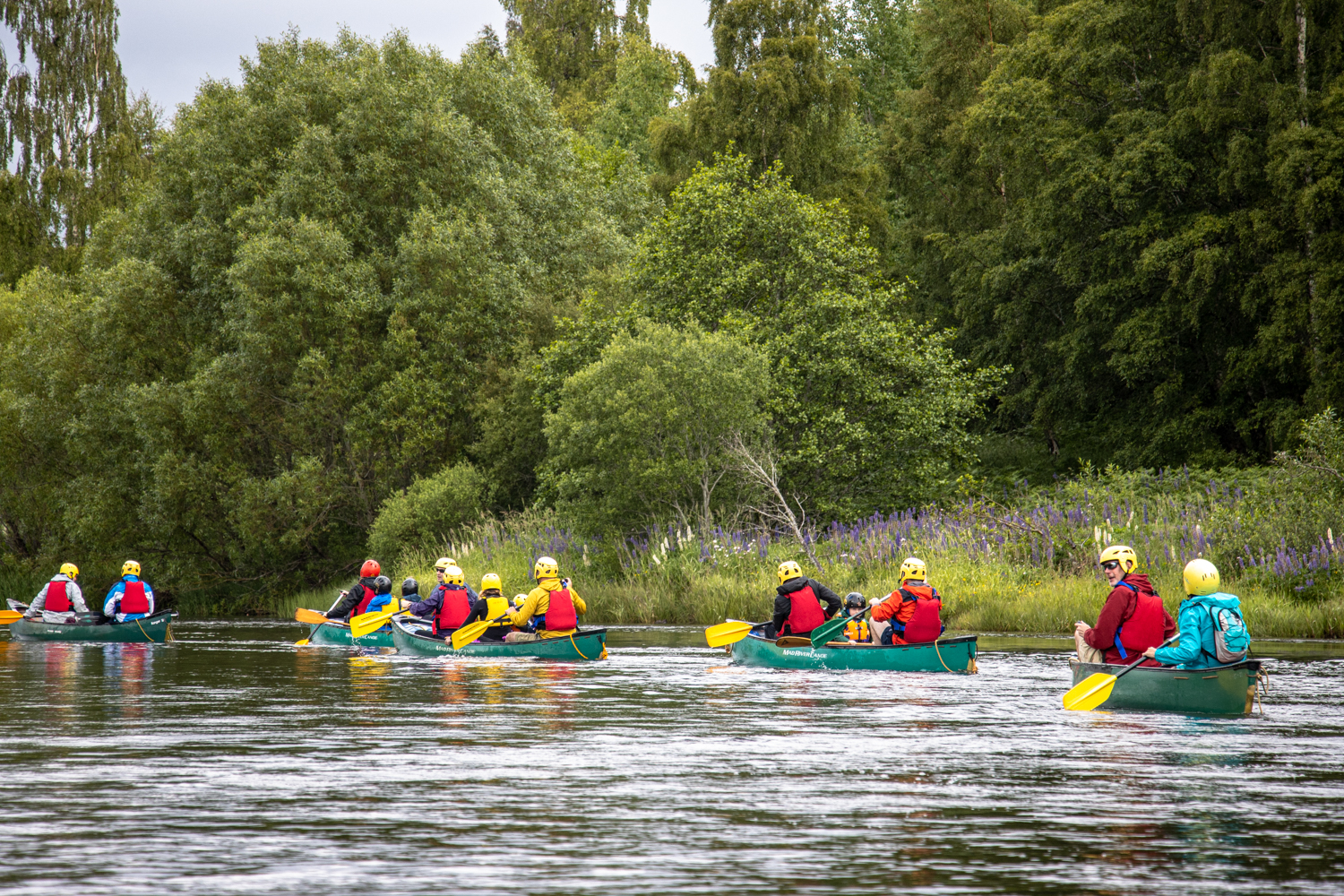 A family enjoying a family canoeing session with Cairngorm Activities