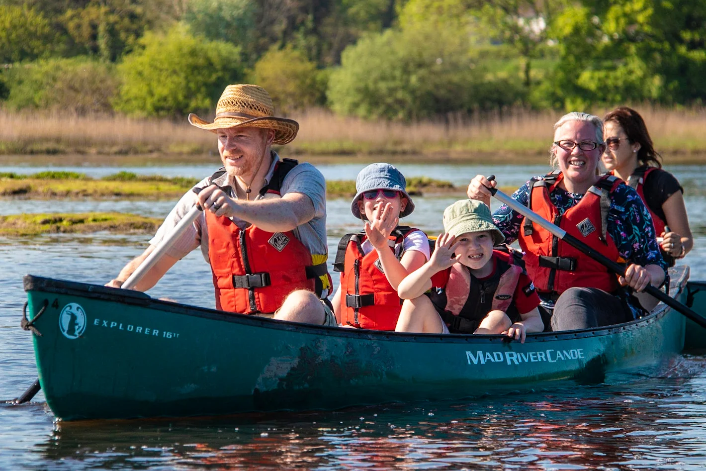A family enjoying a canoeing session on the River Spey