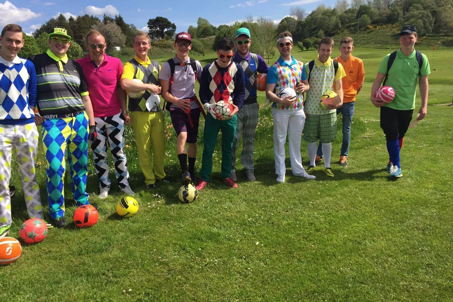 Adults playing footgolf