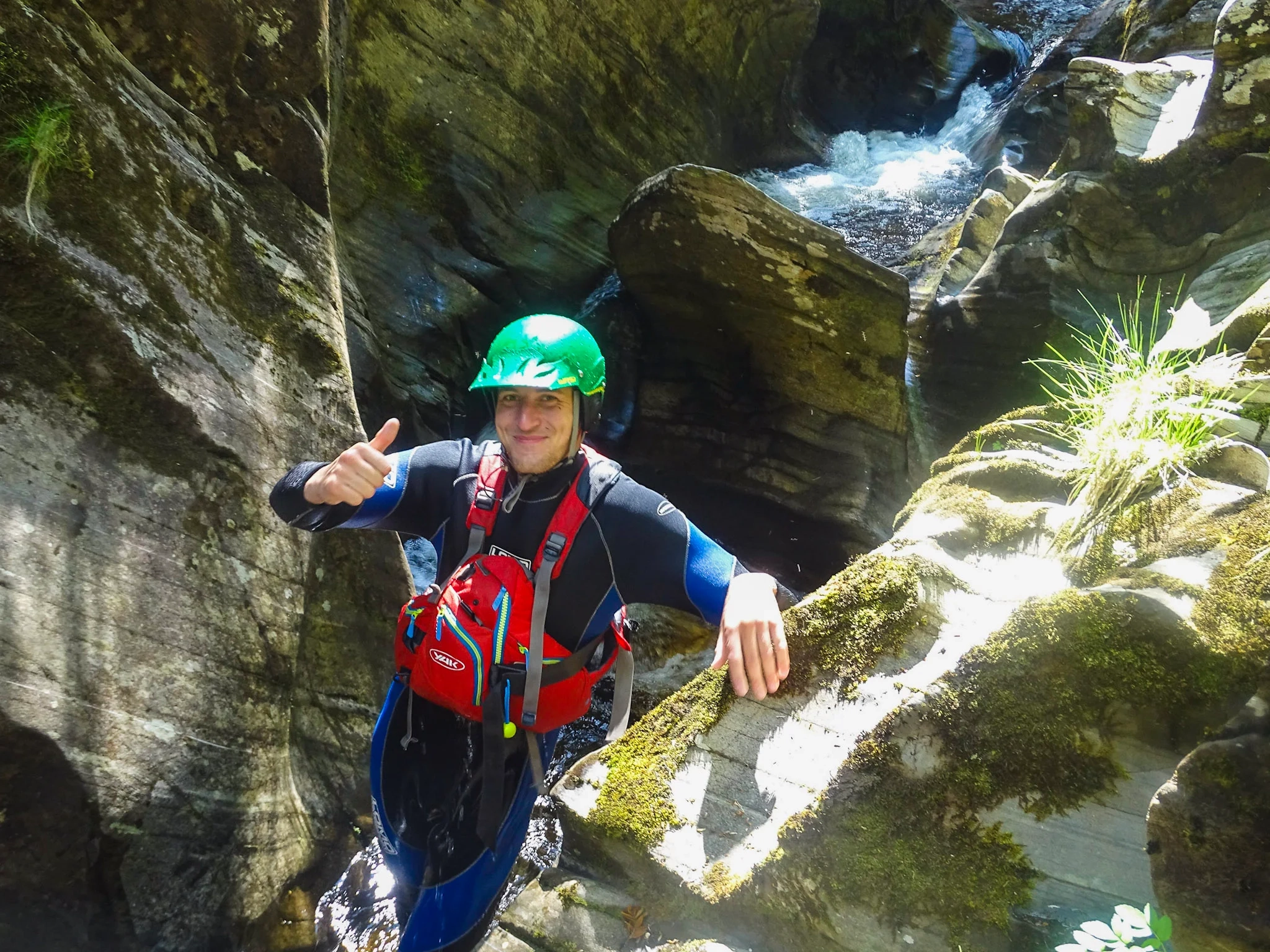 An Outdoor instructor smiling whilst delivering a kayaking session