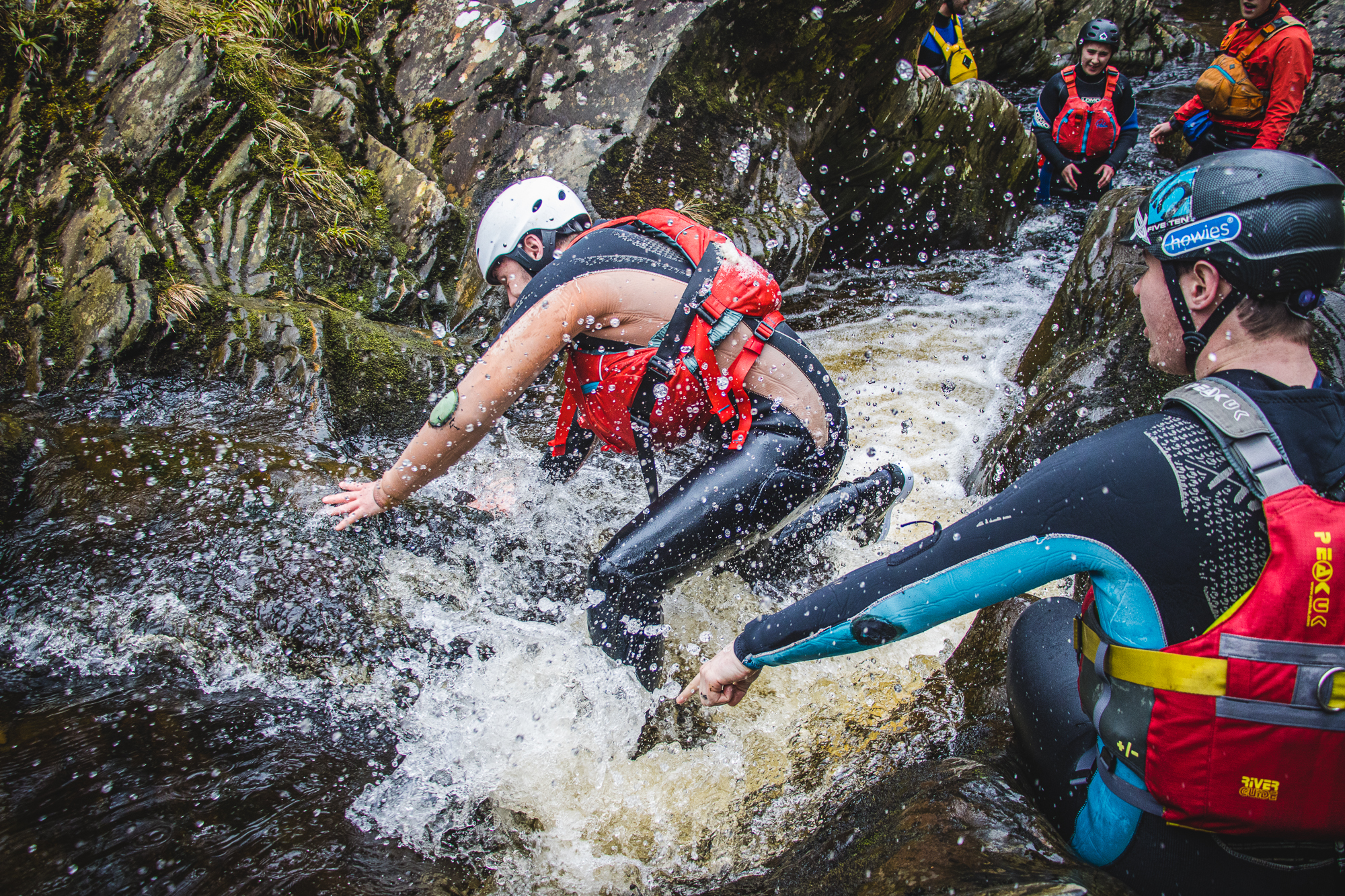 A man taking part in a gorge walking session with Cairngorms Activities