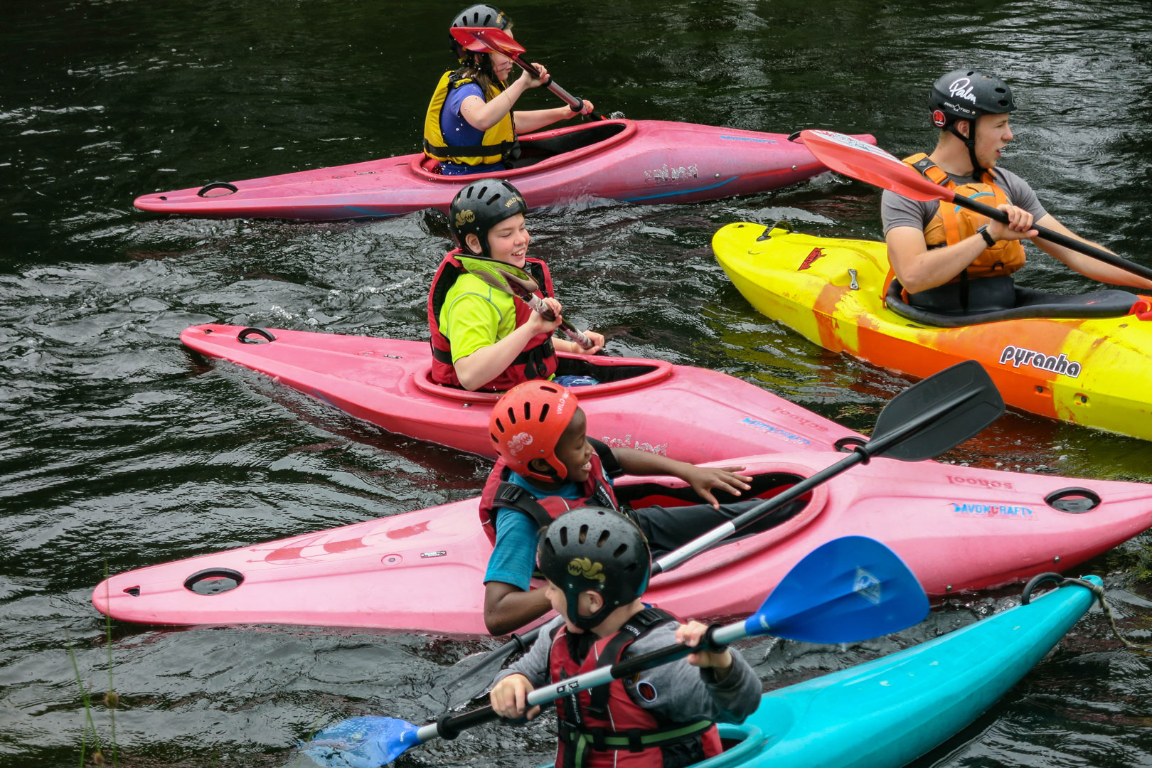 A group kayaking together during a youth group trip