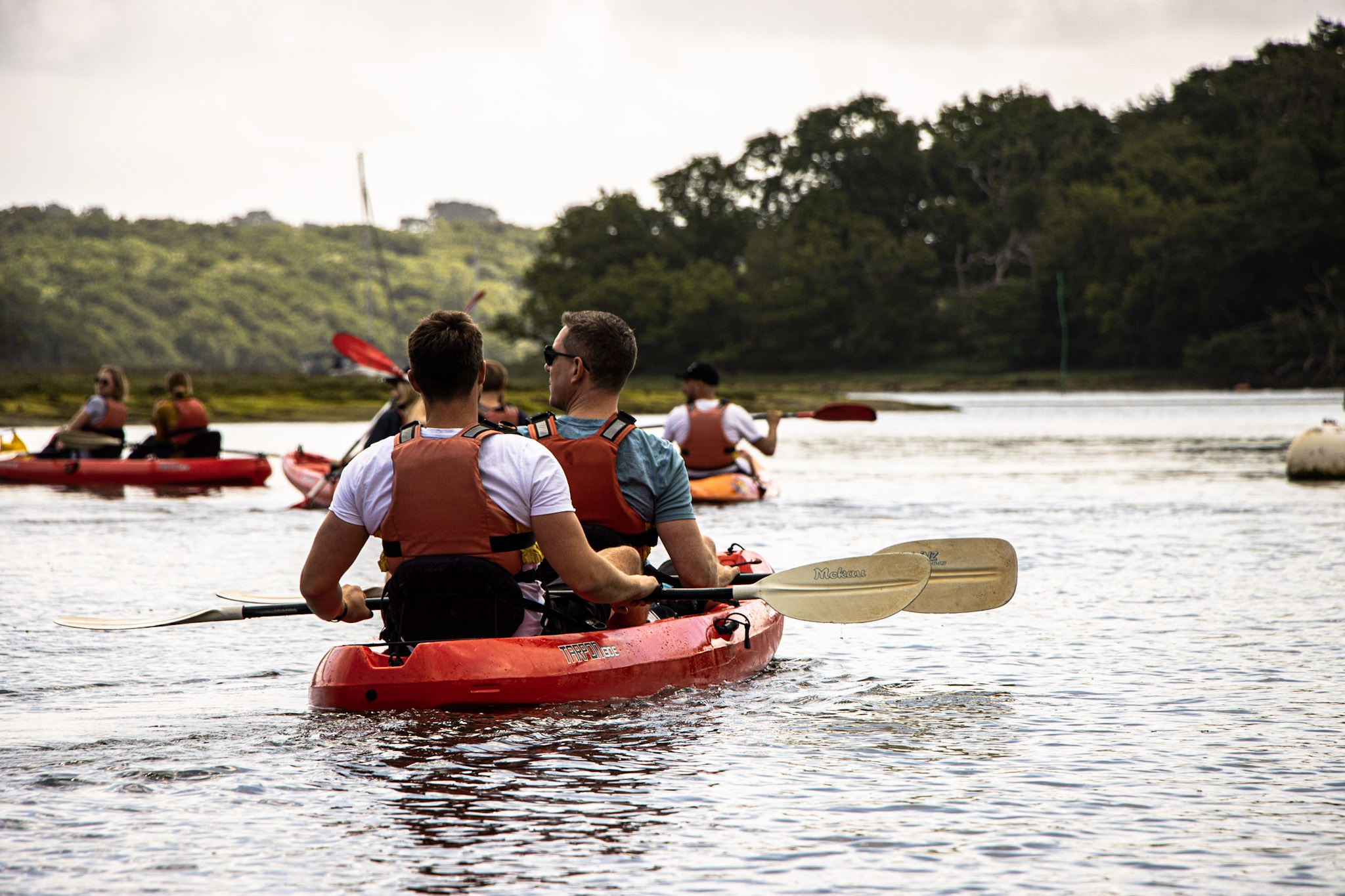 A group enjoying a kayak hire on the River Spey with Cairngorm Activities