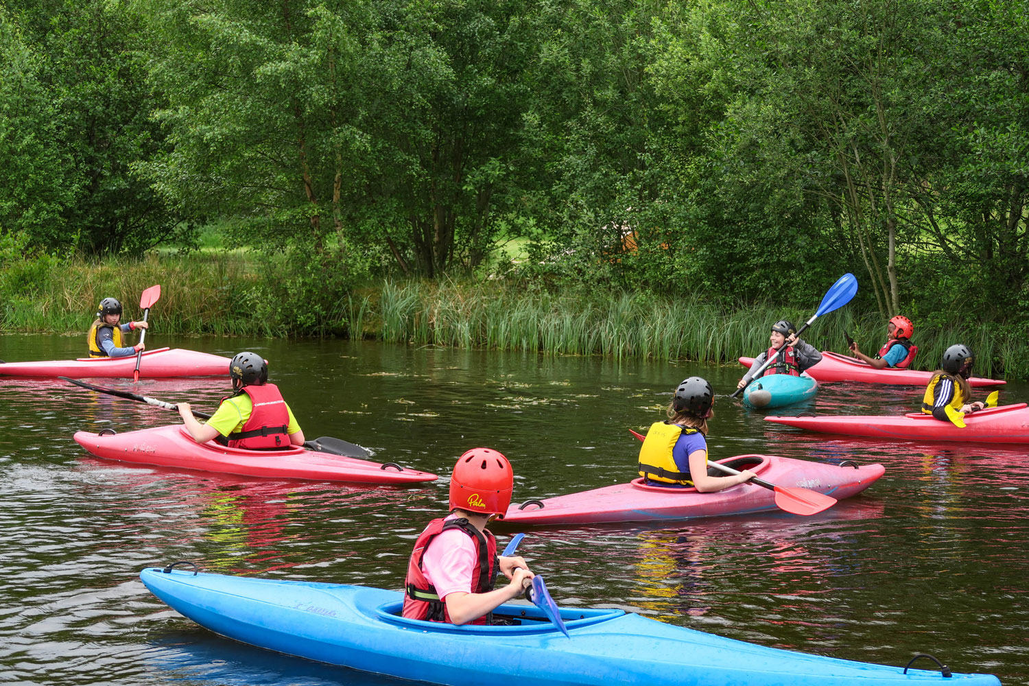 A scout group kayaking at Cairngorms Activities