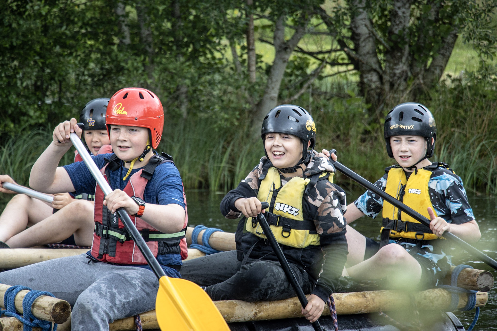 A family enjoying a canoeing session on the River Spey