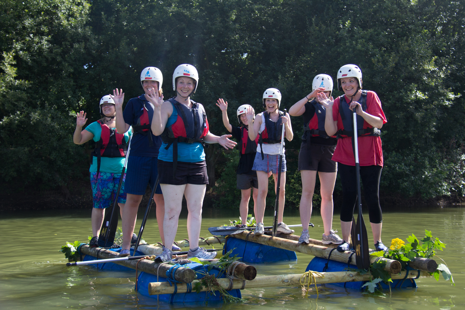 A group of women taking part in a raft building Hen Party