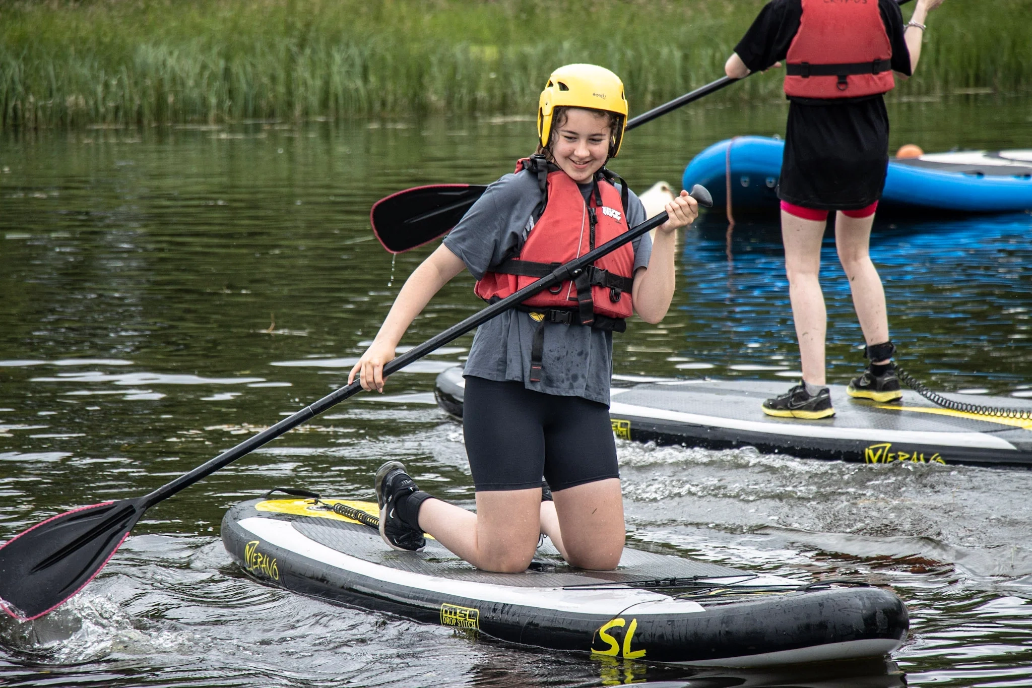 A family enjoying a canoeing session on the River Spey