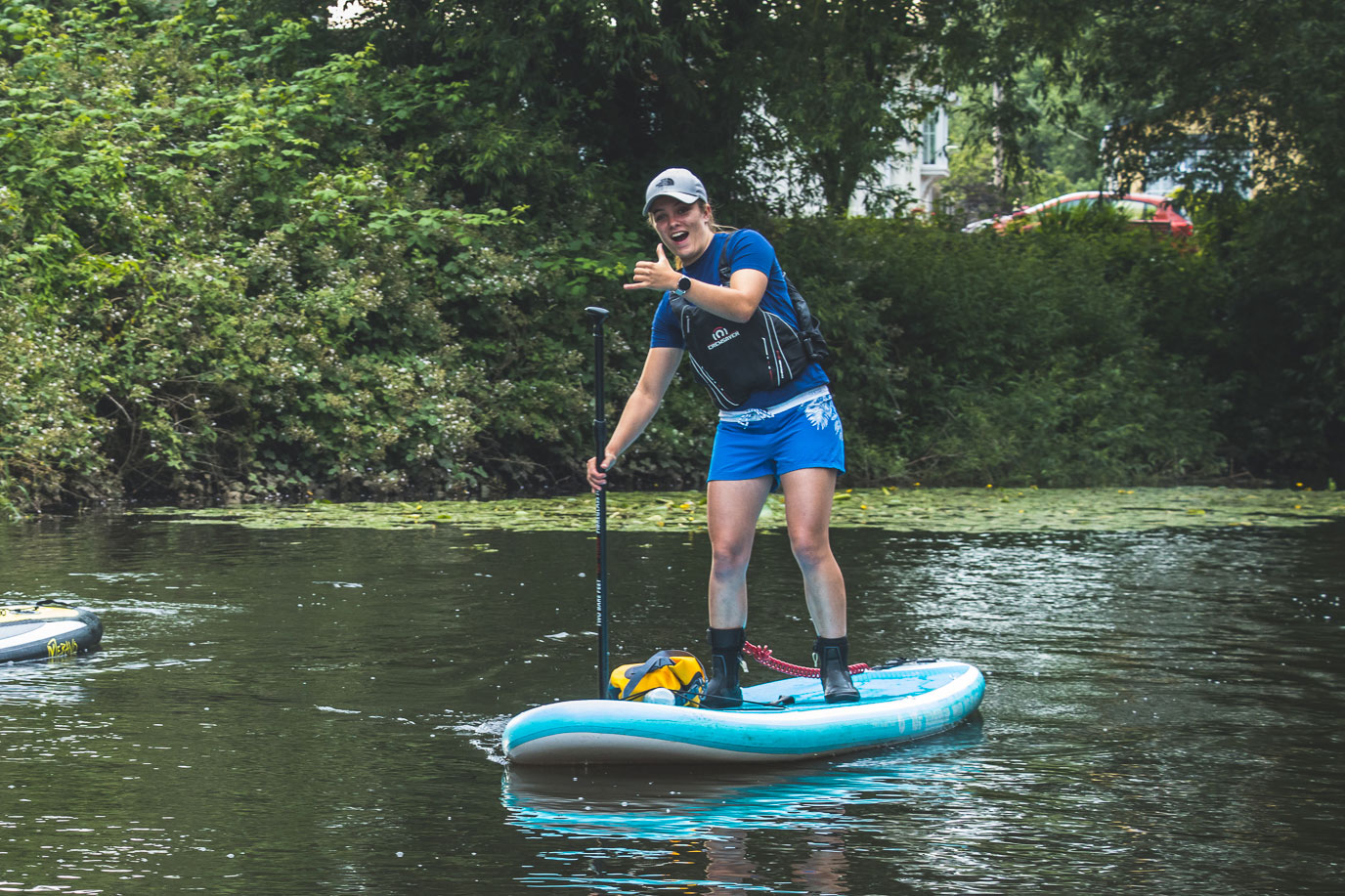A woman enjoying stand-up paddleboard hire at Cairngorms Activities