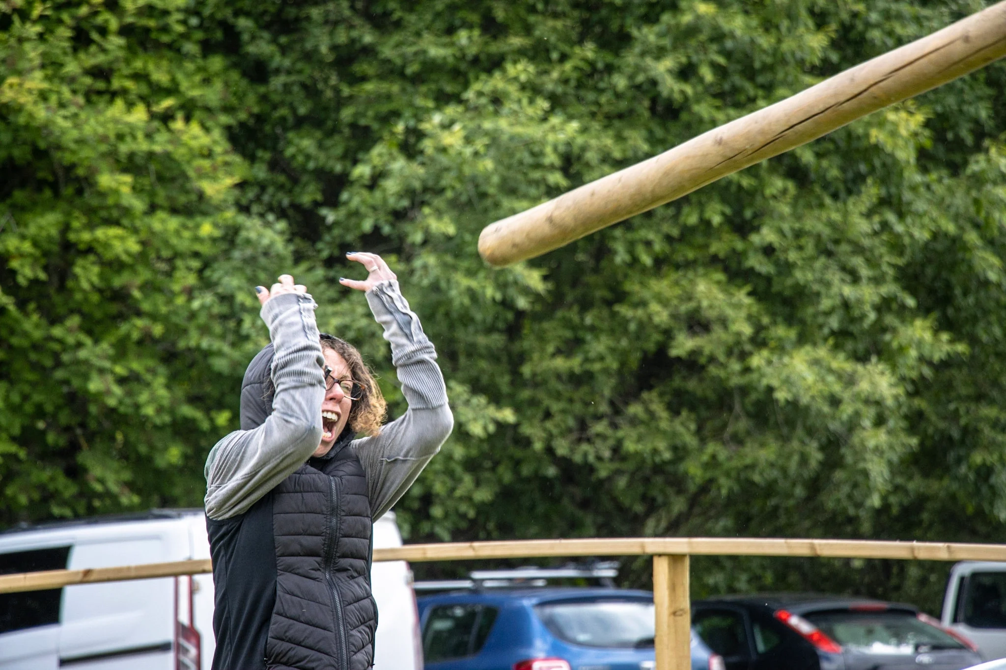 Hens taking part in caber toss during a Highland game