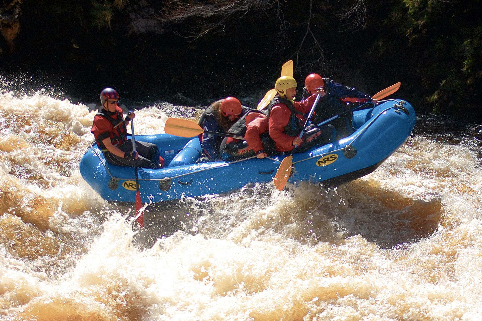 A group of friends enjoying a White Water Rafting session in the Cairngorms