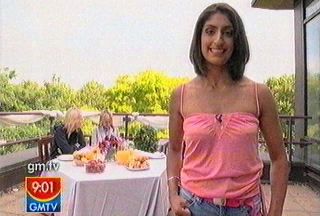 Jatinder Sumal presents to camera during her live 'test' on GMTV for C4's Faking It