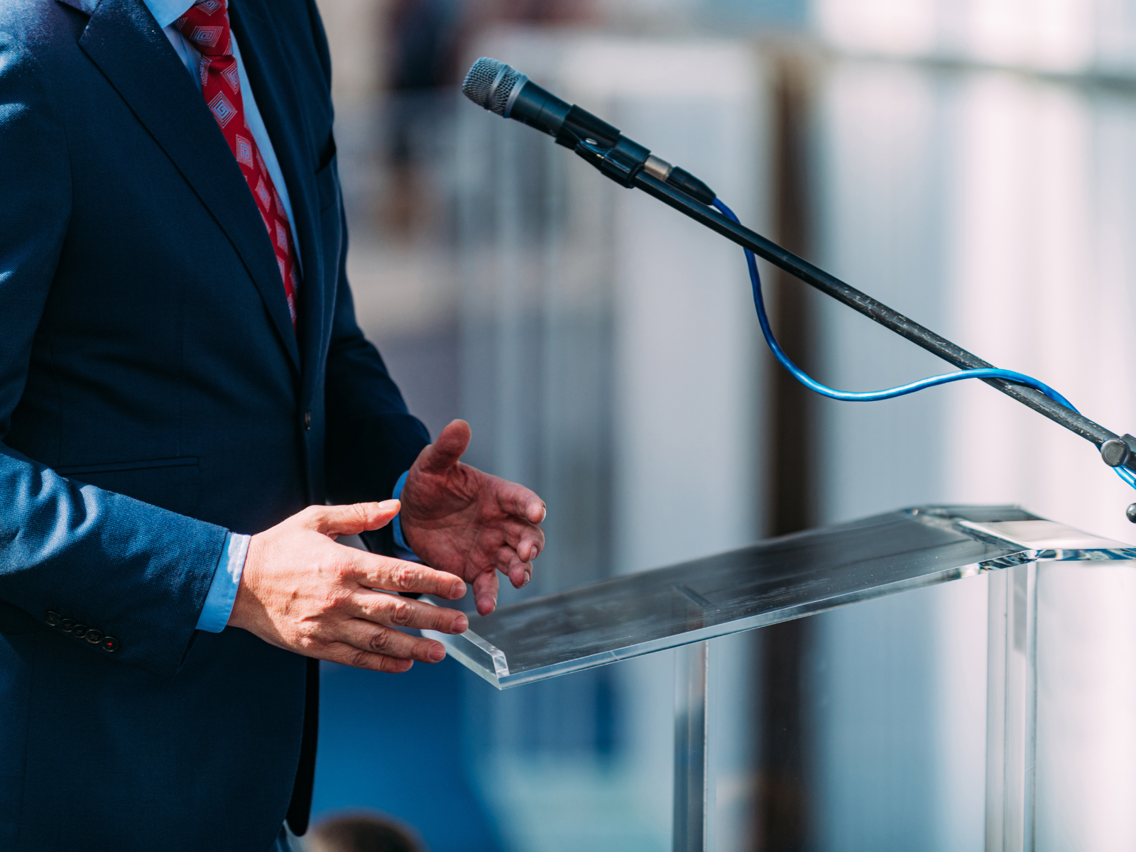 election manifesto public policy professionala speaking into microphone