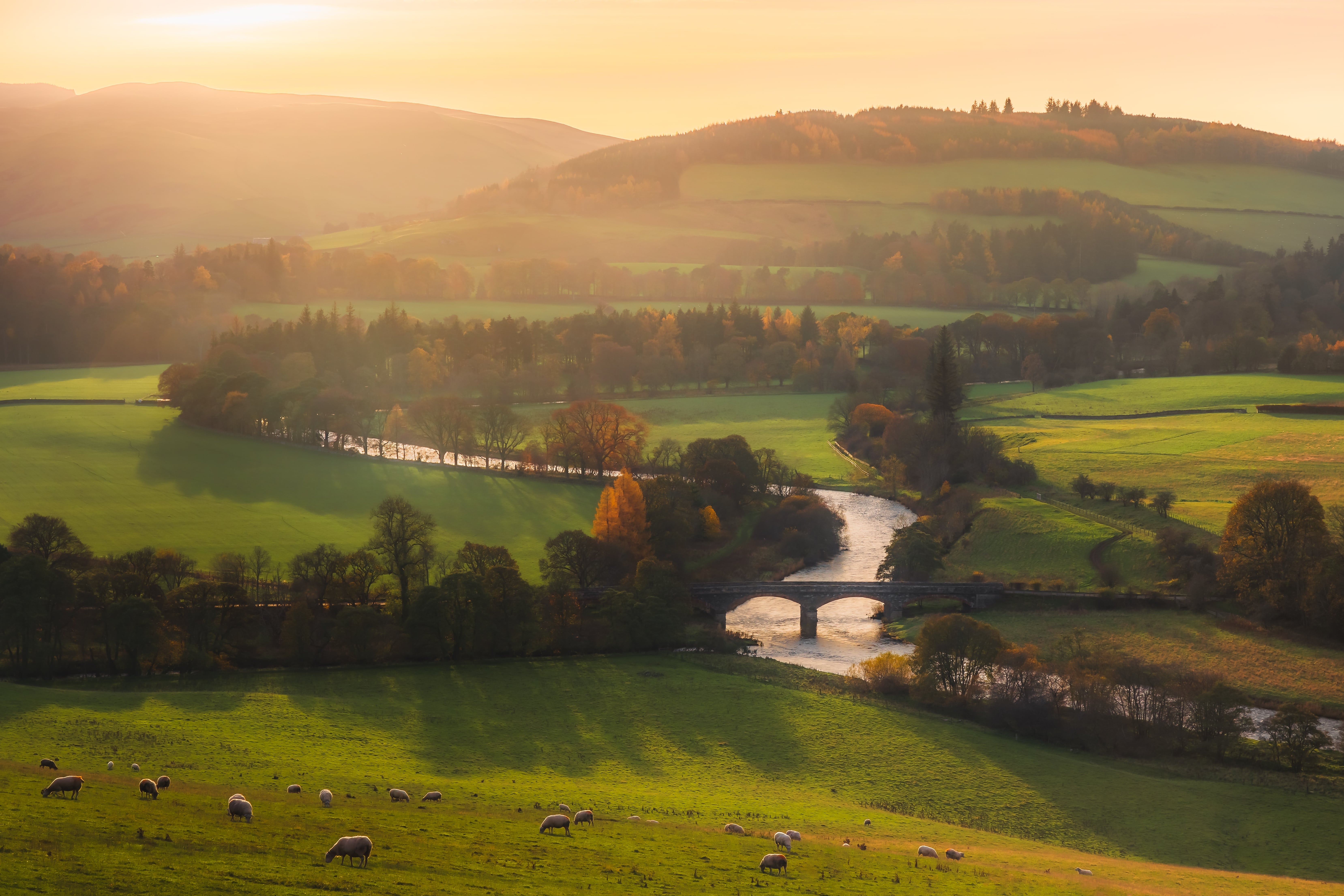 View of hills, bridge and river
