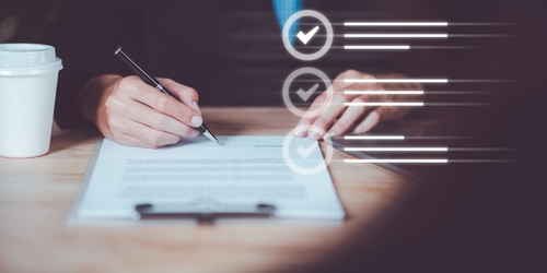 A person ticking boxes in the IR35 process