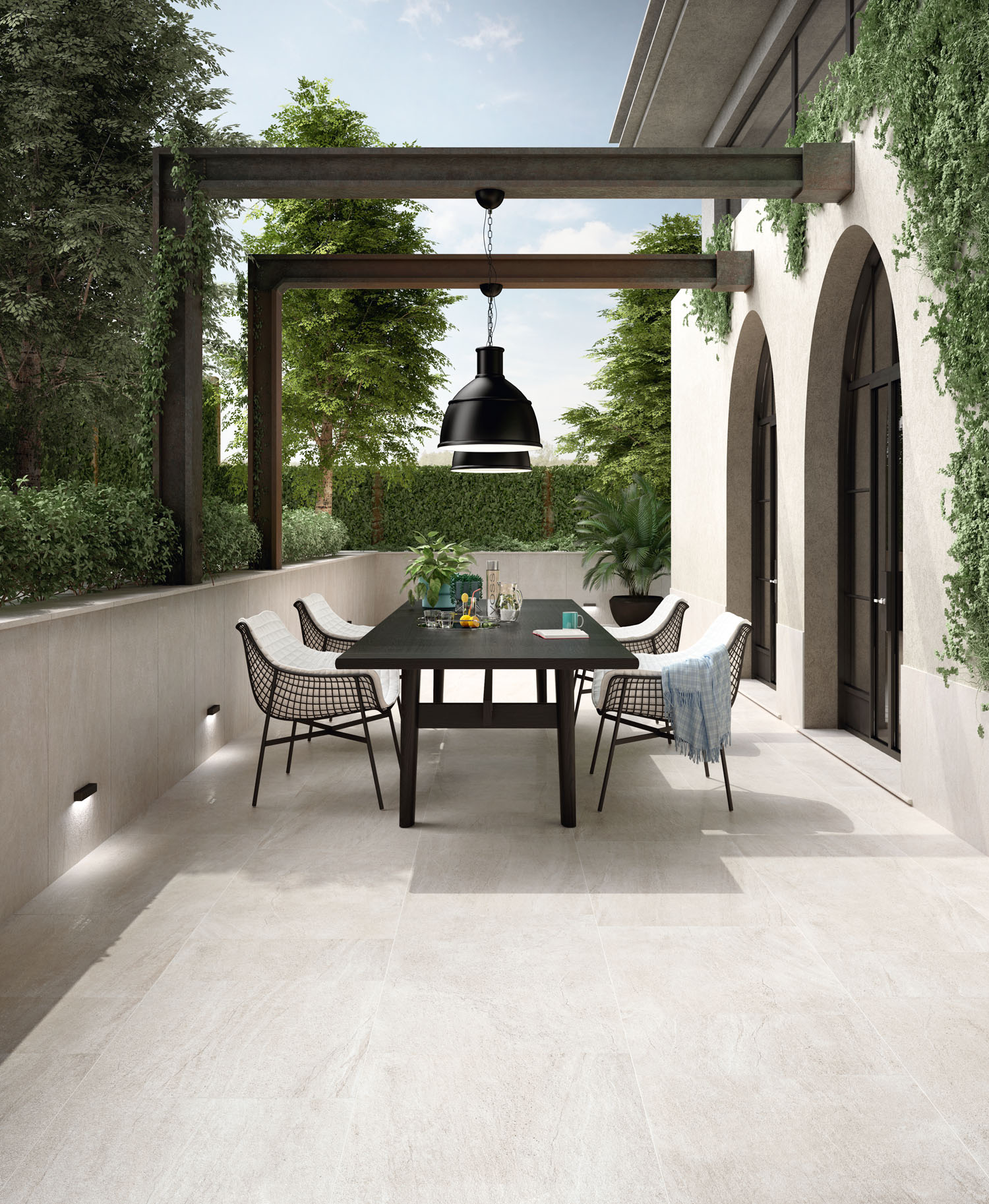 Atlas Snow paving in a modern, mediterranean outdoor dining area.